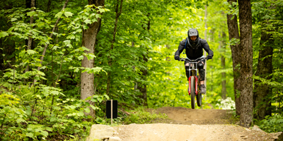 2025 downhill bike park summit attendee mid air